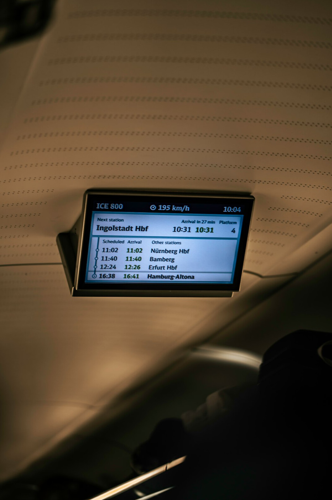 Desk with monitor displaying an insurance software dashboard in a modern office